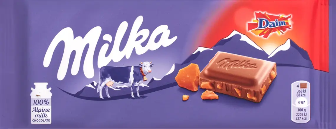 Шоколад Milka молочний з шматочками хрусткої карамелі і мигдалем 100г